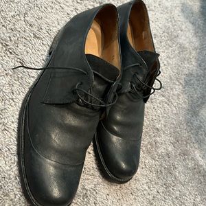 Used John Varvatos dress shoes in color black, made in Italy with leather sole.
